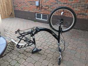 bicycle flipped upside down with it's rear wheel taken off